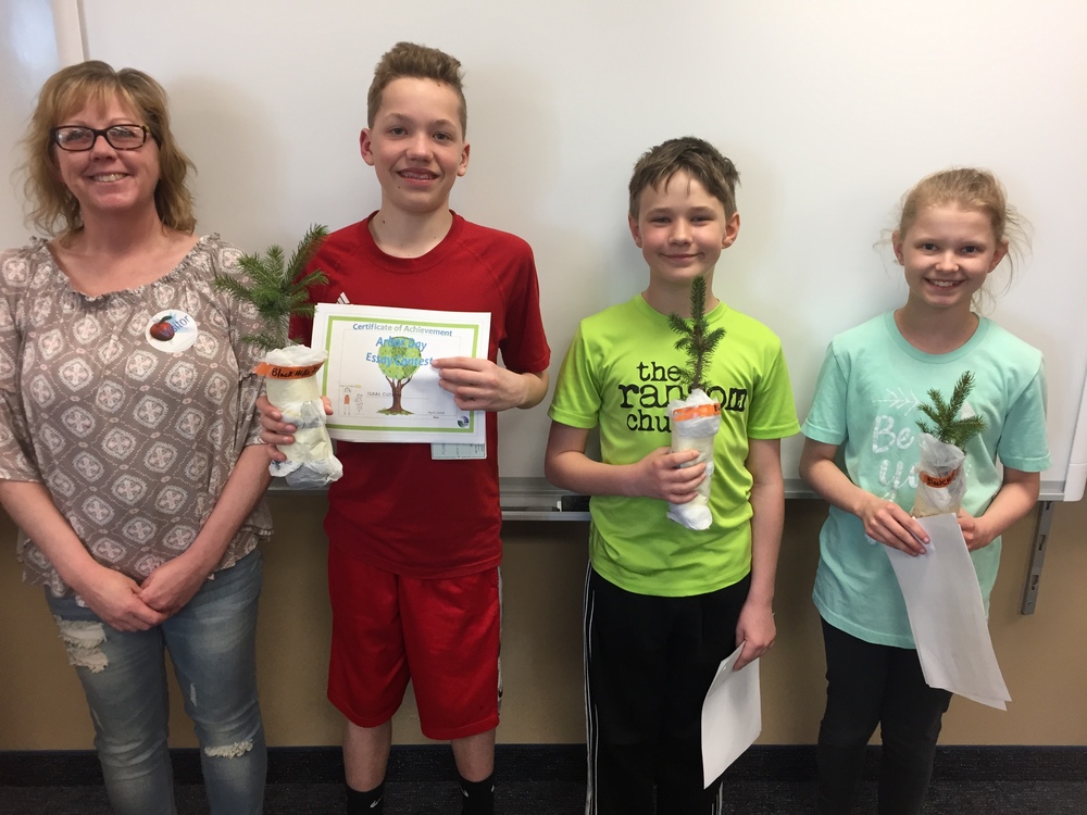 Team Norris students pose with their Arbor Day seedlings.