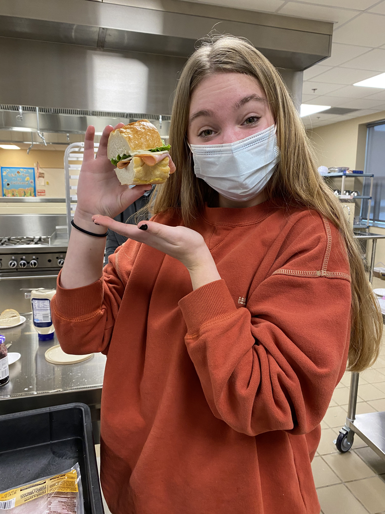 Enjoying her sandwich artistry with homemade lean dough